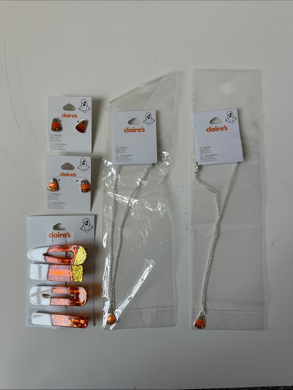 Bundle of Claire’s Candy Corn Charm Jewelry - Earrings, Hair Clips & Necklaces